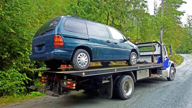 San Francisco flatbed towing a cargo van