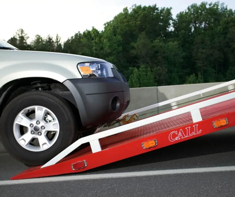 San Francisco tow truck loading a vehicle on a residential street