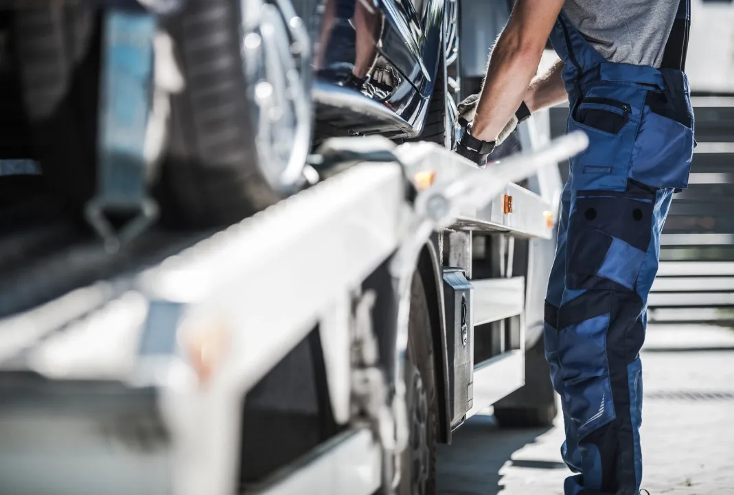 San Francisco tow truck driver loading a car onto a flatbed